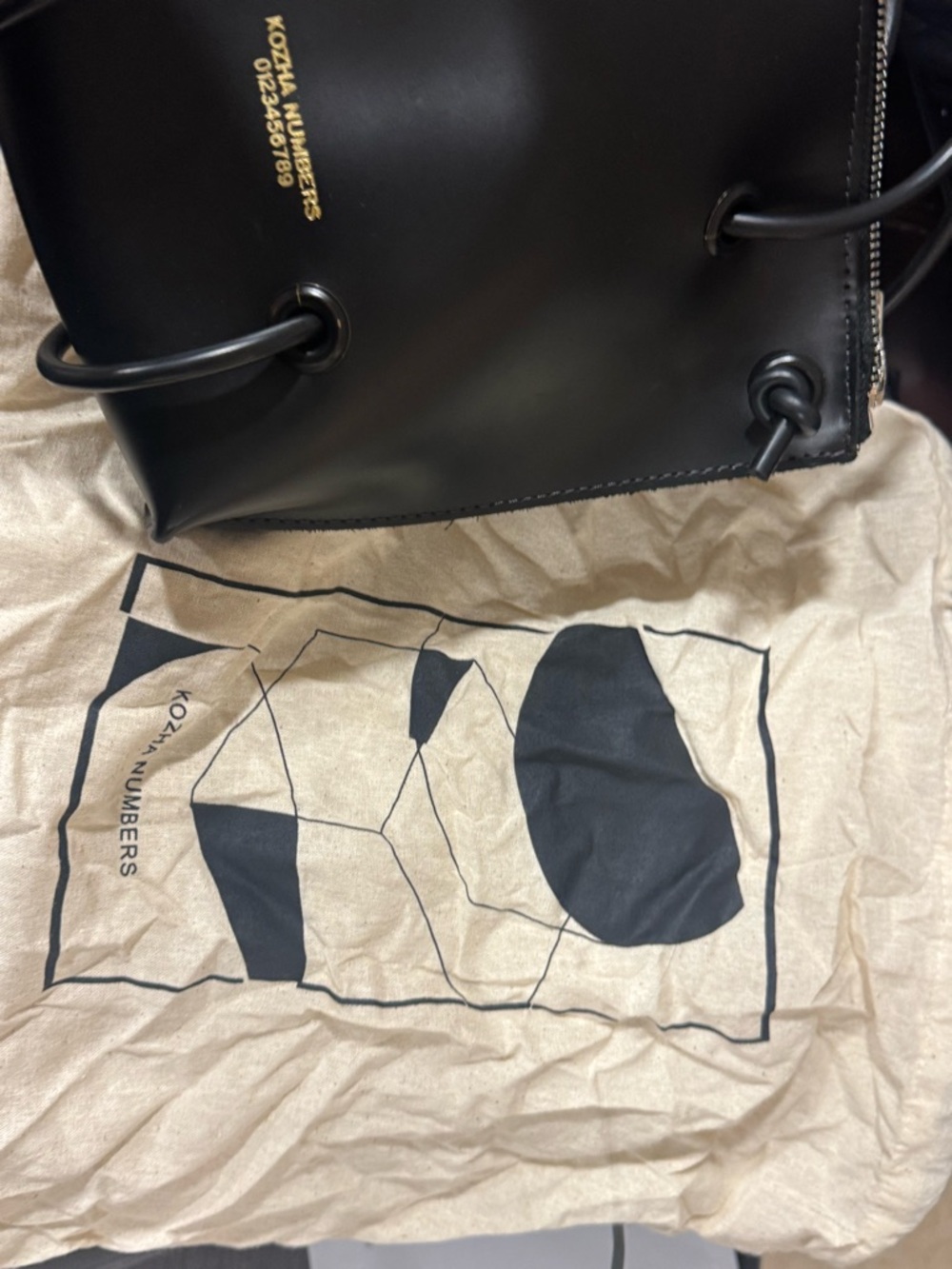 black 100% leather KOZHA NUMBERS utility purse with zipper closure - Picture 7 of 9